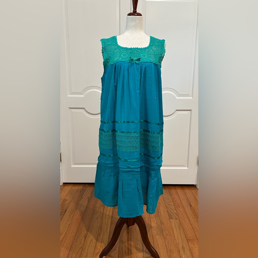 Artisanal Mexican women’s  summer dress is made with crochet and cotton manta.
